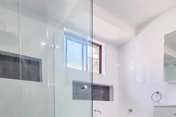 image of a bathroom with glass window, bathtub and bathroom vanity that took place on bathroom renovations st clair