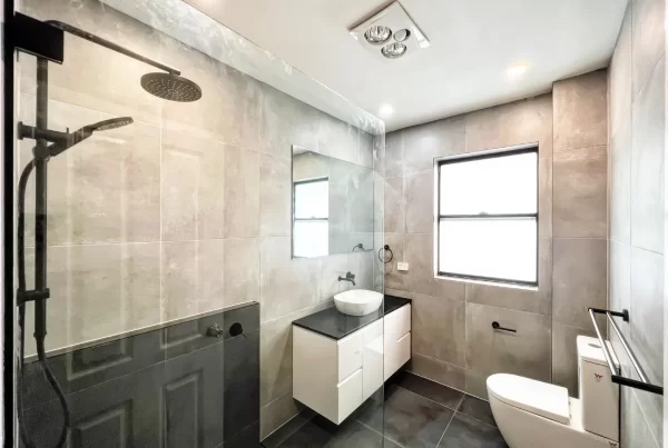 image of a bathroom with toilet, shower and bathroom vanity that was completed on homebush west bathroom renovation
