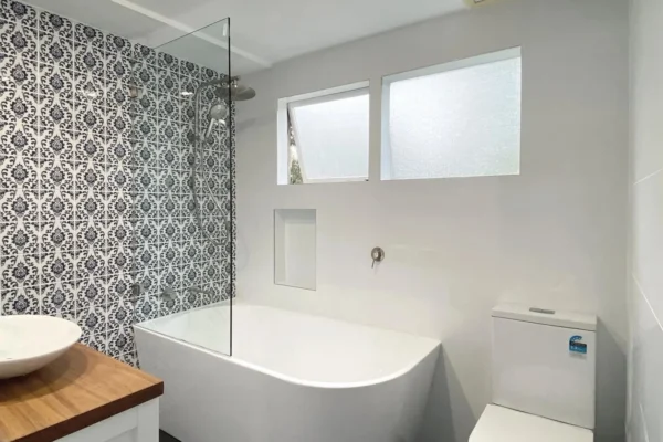 image of a bathroom with toilet, bathtub, shower and bathroom vanity