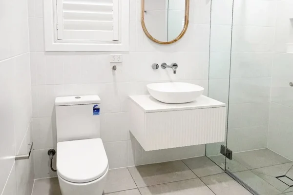 image of a bathroom vanity in the middle of a toilet and shower for bathroom renovations in curl curl