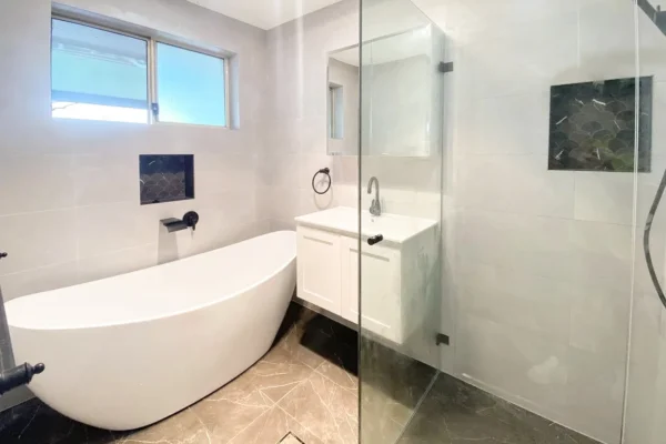 image of a bathroom with bathtub, shower and bathroom vanity that was completed on Bathroom Renovators Kenthurst