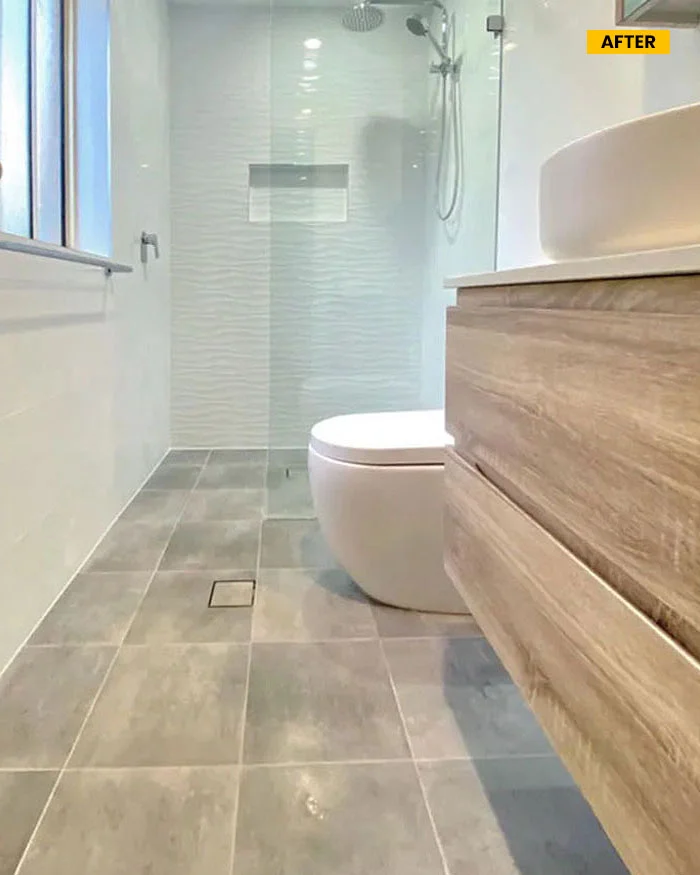 image of a bathroom with toilet and shower, after renovation in oakhurst