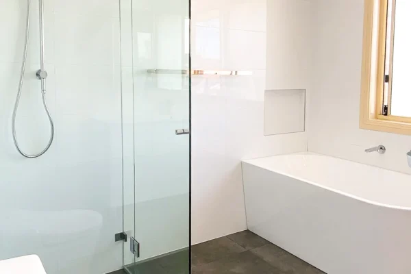 image of a bathroom with shower and bathtub that was completed on bathroom renovations west hoxton