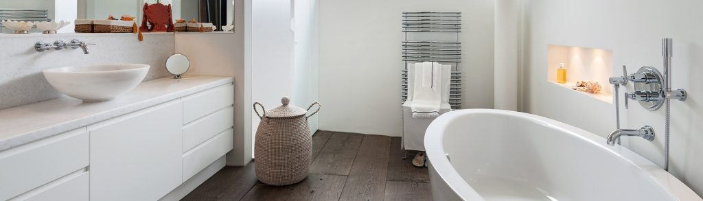 image of a bathroom with bathtub and vanity for topic about create the perfect bathroom