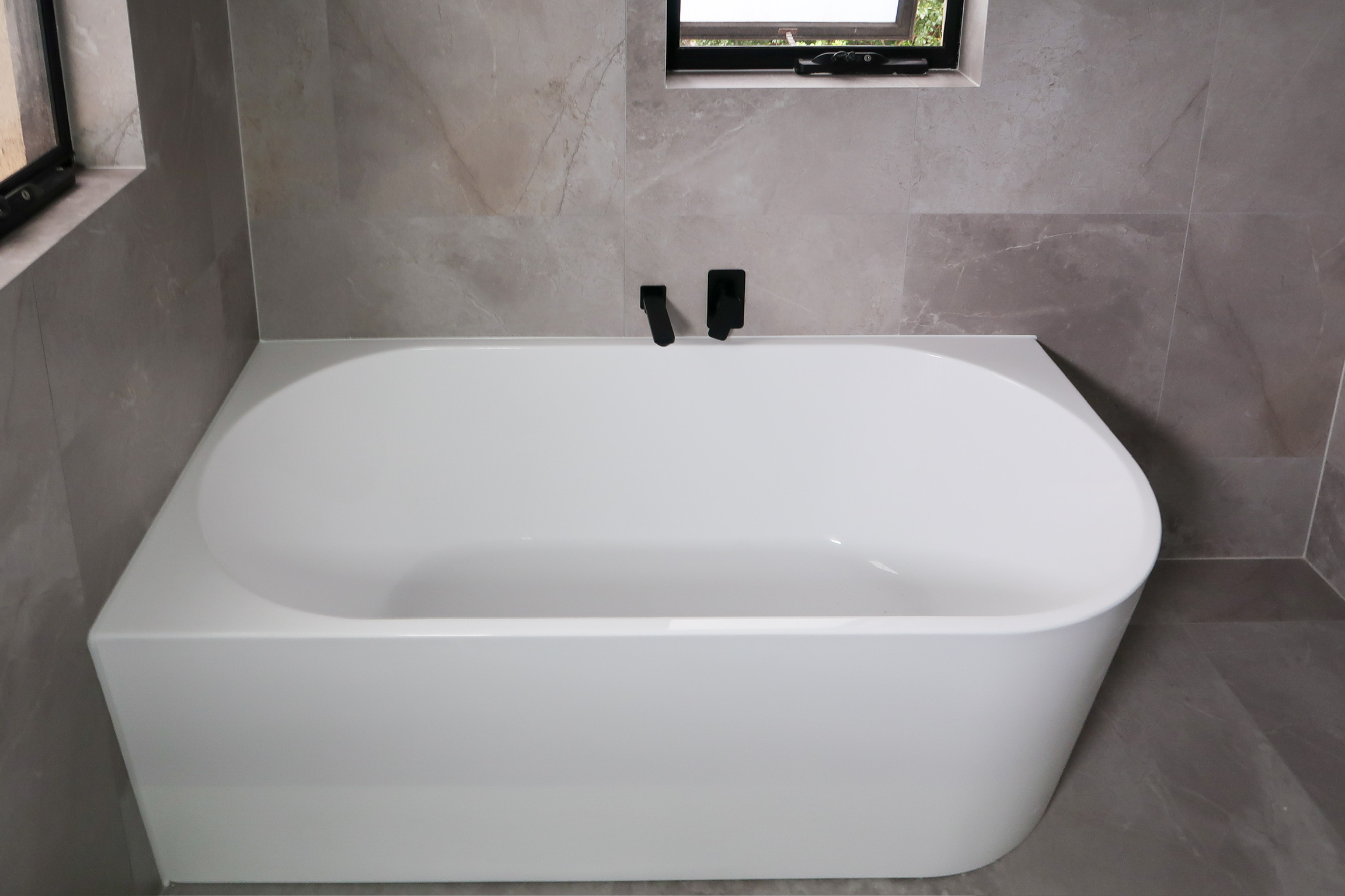 image of a bathtub for topic on bathroom renovation done by RJG Group team