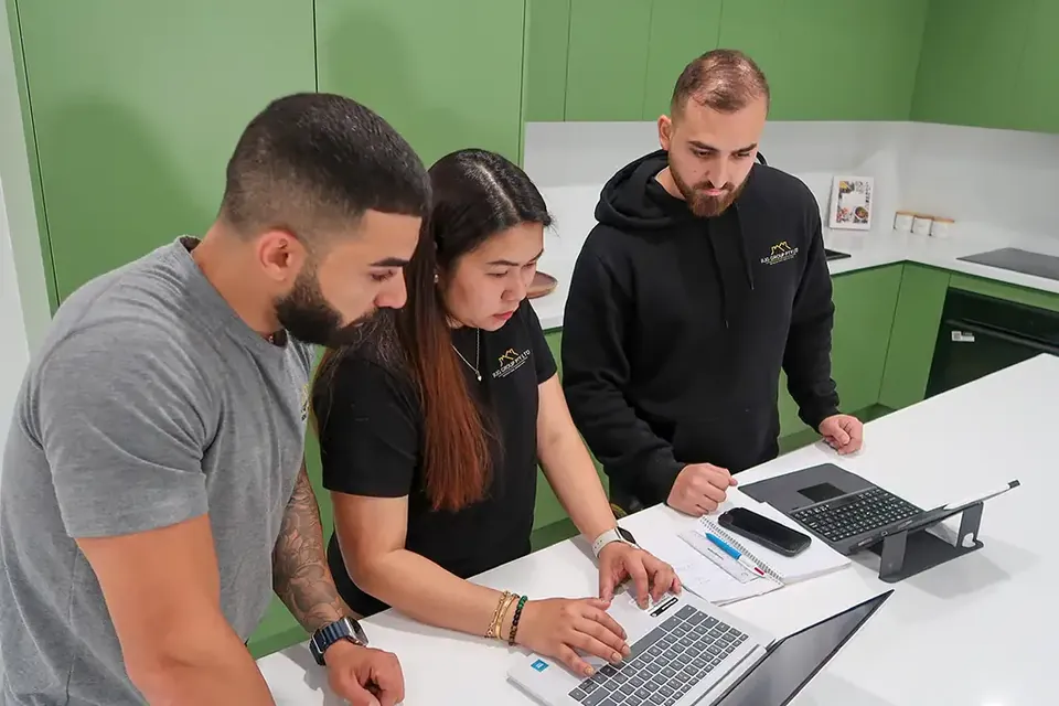 RJG Group team reviewing project plans together